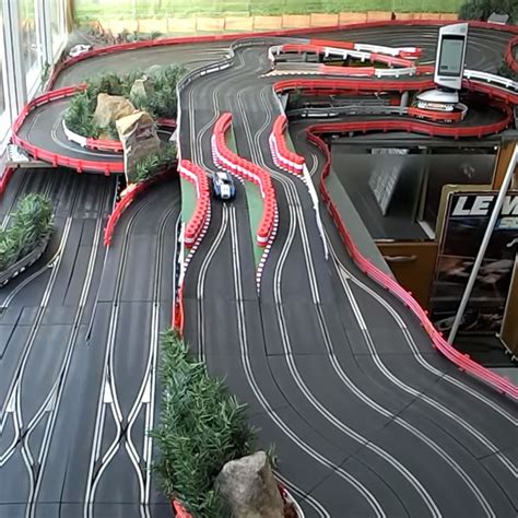 5' with a functioning pit lane and six XLCs. . Will scalextric work on carrera track
